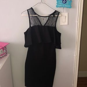 a black dress , lace in the back